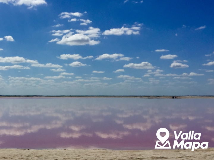Pink water at Las Coloradas in Yucatan with salt flats and bright sky