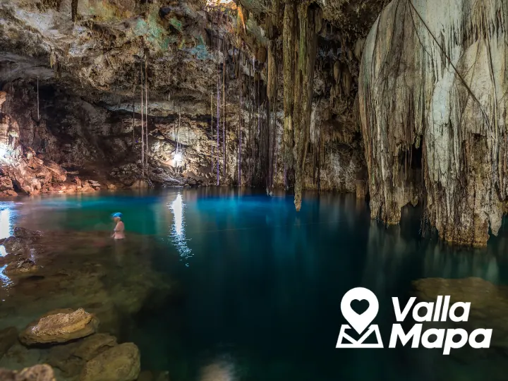 Cenote near Valladolid with clear water and limestone walls connected to Maya history