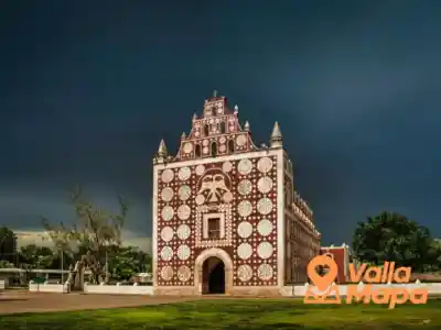 Red and white church facade in Uayma near Valladolid, Yucatan