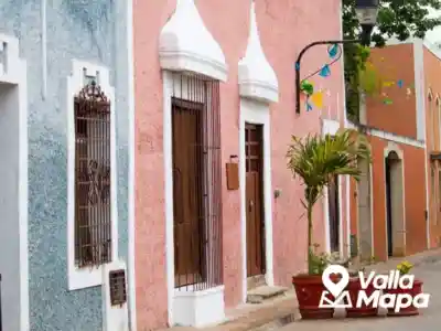 Traditional Valladolid neighborhood street with colorful Yucatecan homes and shade